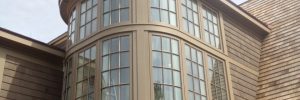 Curved Glass Window in Front of Home